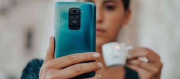 Un Xiaomi Redmi (imagen referencial) Un Xiaomi Redmi (imagen referencial) - Sputnik Mundo