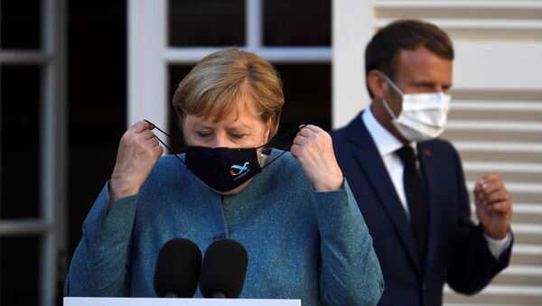 La canciller alemana, Angela Merkel, y el presidente francés, Emmanuel Macron - Sputnik Mundo