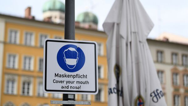 Una señal acerca del uso de mascarilla en Marienplatz en Munich (Alemania) - Sputnik Mundo