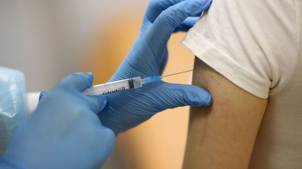 Aplicación de vacuna contra el coronavirus  - Sputnik Mundo