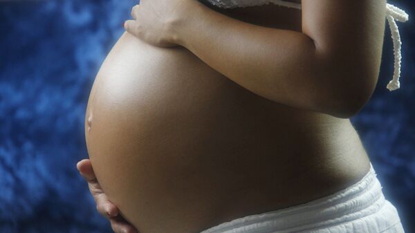 Imagen referencial de una mujer embarazada - Sputnik Mundo