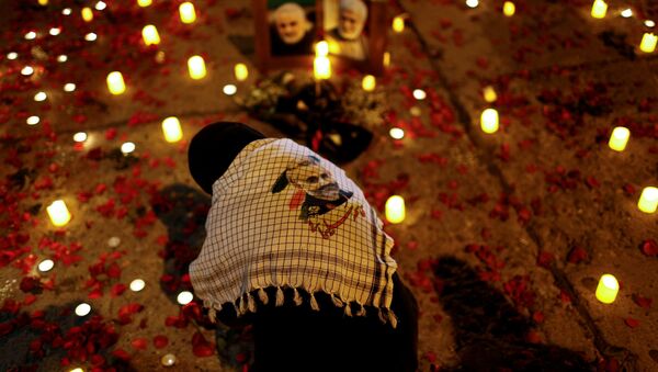 Una mujer en Bagdad (Irak) lamenta la muerte de Qasem Soleimani y Abu Mahdi Muhandis a un año de sus asesinatos. - Sputnik Mundo
