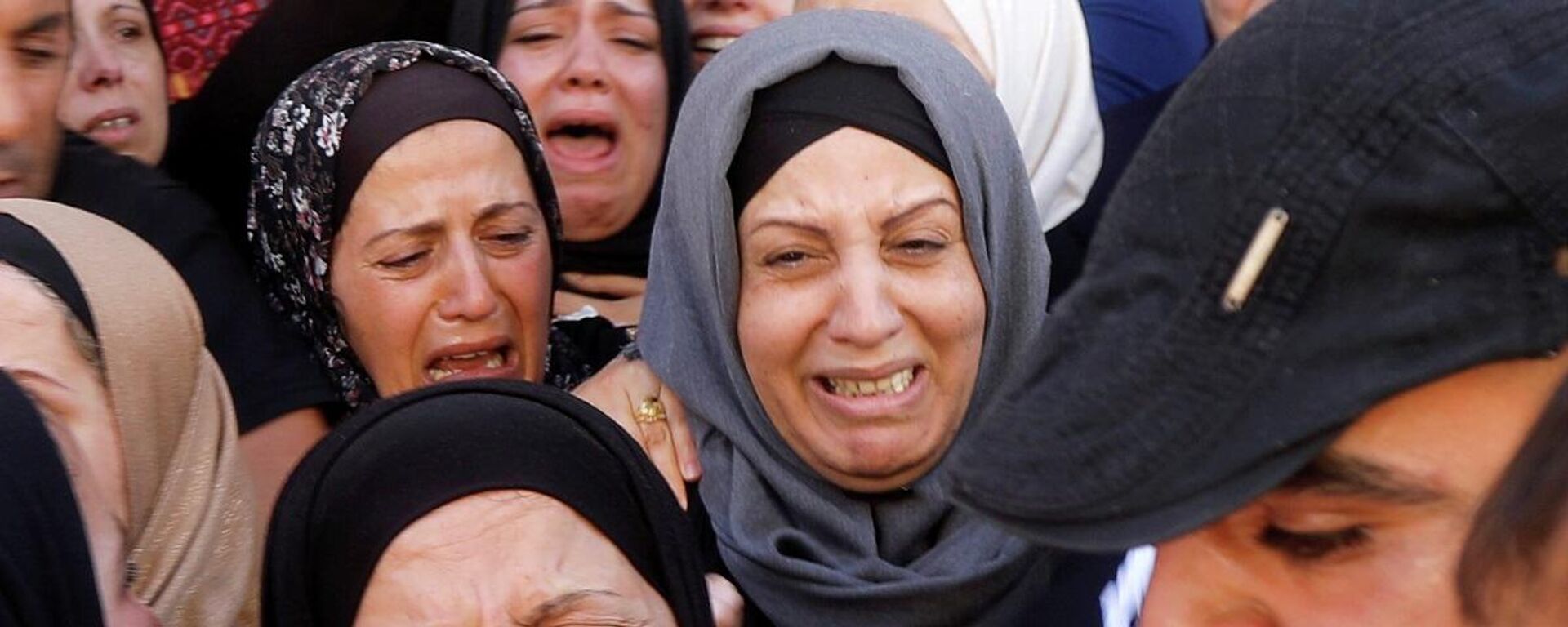 Mujeres palestinas lloran - Sputnik Mundo, 1920, 16.05.2021