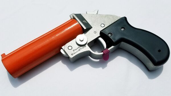 Una pistola de bengalas, imagen ilustrativa - Sputnik Mundo