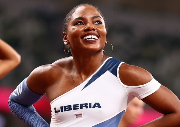 La atleta de Liberia Ebony Morrison en las semifinales de los 100 metros vallas, el 1 de agosto de 2021.  - Sputnik Mundo