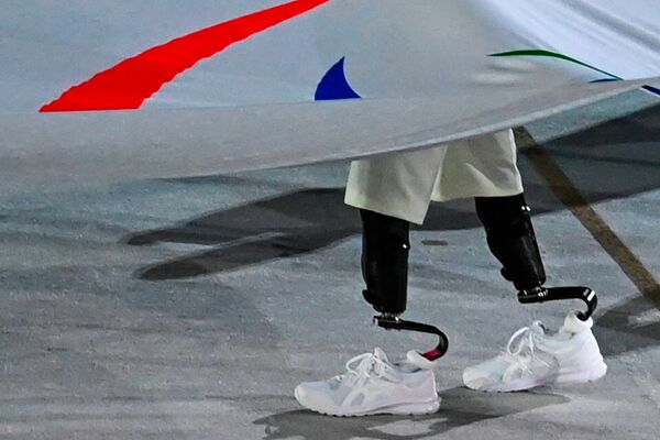 La bandera paralímpica en la ceremonia de inauguración de los Juegos Paralímpicos de Tokio. La bandera paralímpica en la ceremonia de inauguración de los Juegos Paralímpicos de Tokio. - Sputnik Mundo