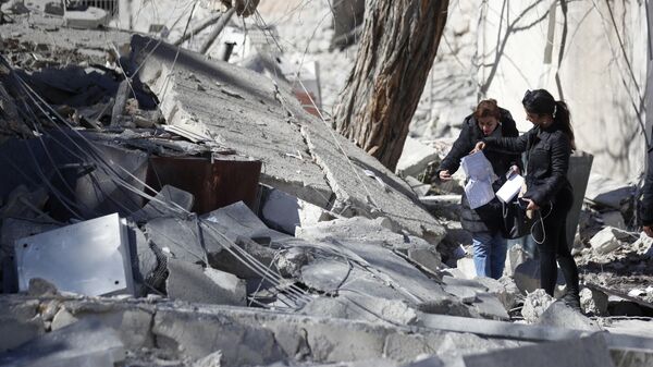Consecuencias del ataque aéreo israelí en la ciudad capital de Damasco, Siria - Sputnik Mundo