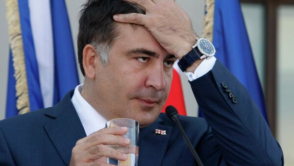 Georgian President Mikhail Saakashvili gestures during a news conference with NATO Secretary General Anders Fogh Rasmussen in the presidential palace in Tbilisi on June 27, 2013 - Sputnik Mundo