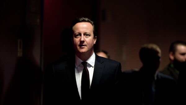 British Prime Minister David Cameron arrives for a press conference on March 20, 2015 at the end of a European Union summit at the EU Council building in Brussels. - Sputnik Mundo