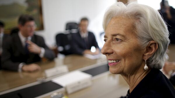 International Monetary Fund (IMF) Managing Director Christine Lagarde (front) reacts during a meeting with Brazil's Finance Minister Joaquim Levy at the Finance Ministry in Brasilia - Sputnik Mundo