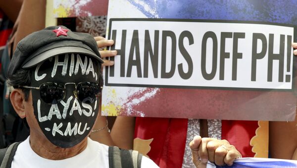 Protesta en contra de la actividad de China en el Mar del Sur de China, Manila, Filipinas, el 7 de julio, 2015 - Sputnik Mundo