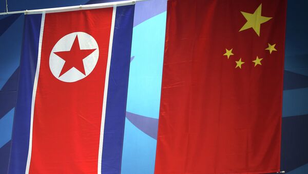 Banderas de China y Corea del Norte - Sputnik Mundo