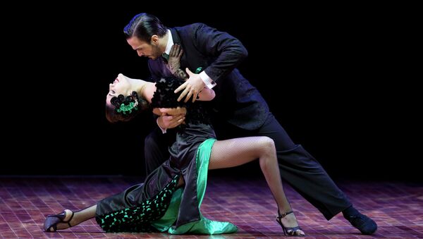 Ezequiel Lopez and Camila Alegre of Argentina compete in the stage category at the World Tango Championship final in Buenos Aires, Argentina, Thursday, Aug. 27, 2015. - Sputnik Mundo