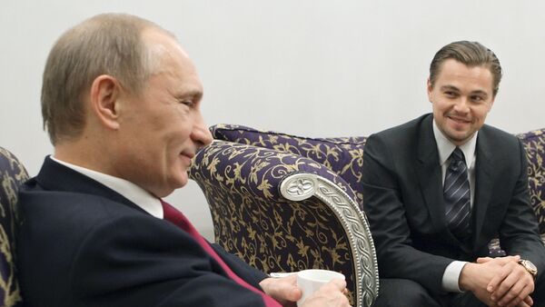 Vladímir Putin y Leonardo DiCaprio - Sputnik Mundo