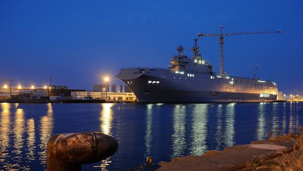 A picture taken on June 23, 2014 in Saint-Nazaire, western France, shows the Vladivostok warship, a Mistral class LHD amphibious vessel ordered by Russia to the STX France shipyard. The Vladivostok warship is one of two navy ships ordered to France by the Russian army. - Sputnik Mundo