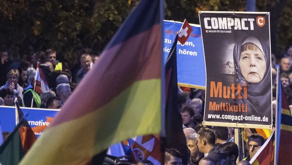 Protestas contra política migratoria alemana - Sputnik Mundo