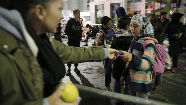 Беженцы с Ближнего Востока в Мюнхене - Sputnik Mundo