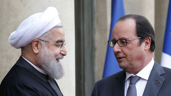 El presidente de Irán, Hasán Rohani, y el presidente de Francia, François Hollande - Sputnik Mundo