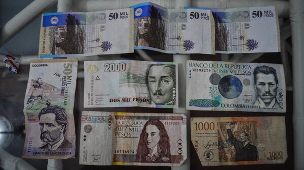 El peso, la moneda de Colombia (archivo) - Sputnik Mundo