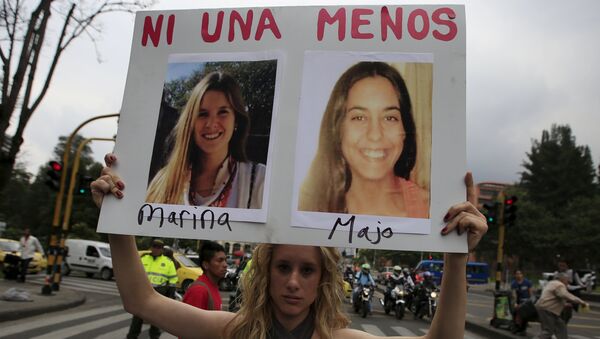 A woman holds a sign during a rally called March of Whores to protest against discrimination and violence against women on International Women's Day in Bogota, Colombia - Sputnik Mundo