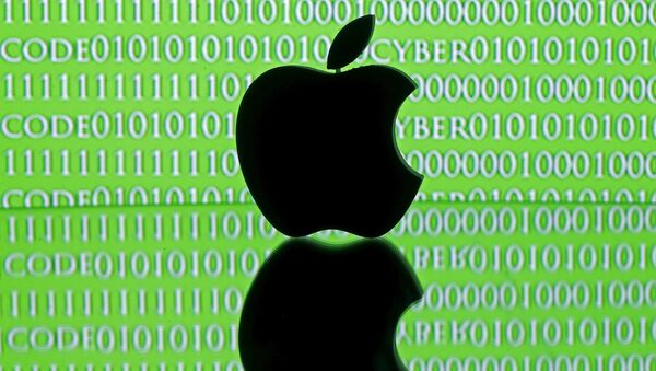 A 3D printed Apple logo is seen in front of a displayed cyber code in this illustration taken February 26, 2016. - Sputnik Mundo