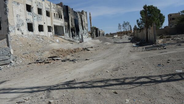 Edificios destruidos en la ciudad de Al Qaryatayn - Sputnik Mundo