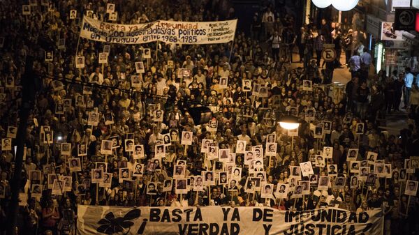 Demonstrators take part in the 20th March of Silence in Montevideo, Uruguay, Wednesday, May 20, 2015.   - Sputnik Mundo