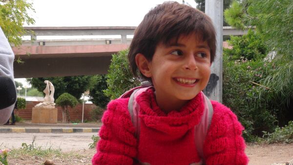 Un niño del liberado barrio Bani Zaid - Sputnik Mundo