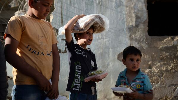 Familias de Latakia y Tartus reciben 1.500 kg de ayuda humanitaria - Sputnik Mundo
