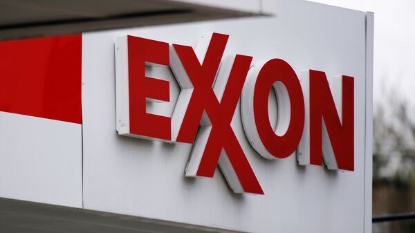 FILE - This April 29, 2014, file photo, shows an Exxon sign at an Exxon gas station in Carnegie, Pa. Low oil prices have helped cost Exxon its pristine AAA credit rating from Standard & Poor's, a label it held for over six decades, S&P announced Tuesday, April 26, 2016. - Sputnik Mundo