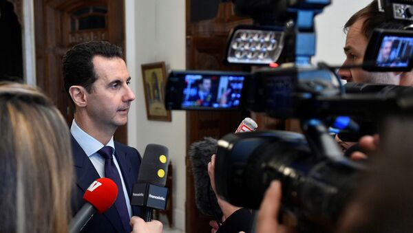 Syria's President Bashar al-Assad speaks to French journalists in Damascus, Syria, in this handout picture provided by SANA on January 9, 2017 - Sputnik Mundo