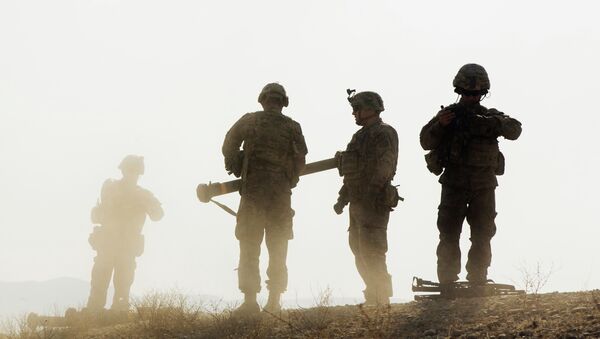 U.S. soldiers from D Troop of the 3rd Cavalry Regiment walk on a hill after finishing with a training exercise near forward operating base Gamberi in the Laghman province of Afghanistan December 30, 2014 - Sputnik Mundo