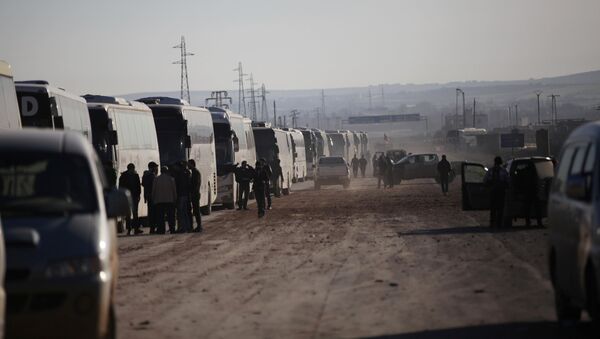 Autobuses con insurgentes en la ciudad siria de Homs (Archivo) - Sputnik Mundo