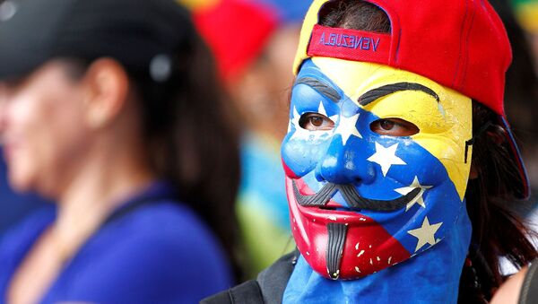 Participante de una manifestación en Venezuela - Sputnik Mundo