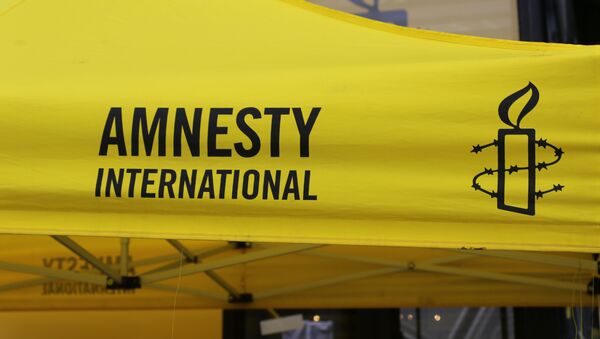 Logo de Amnistía Internacional - Sputnik Mundo
