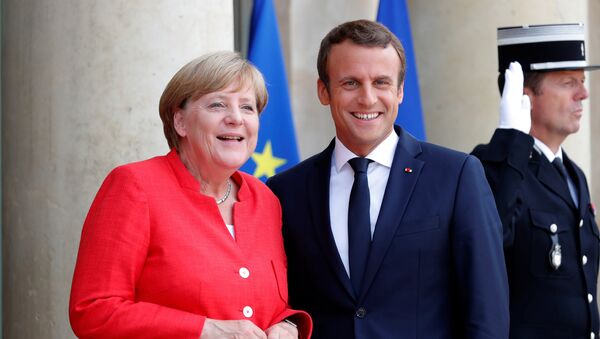 La canciller alemana, Angela Merkel, el presidente de Francia, Emmanuel Macron - Sputnik Mundo