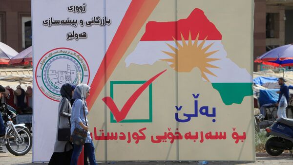 Un cartel con la fecha del referéndum en el Kurdistán iraquí - Sputnik Mundo