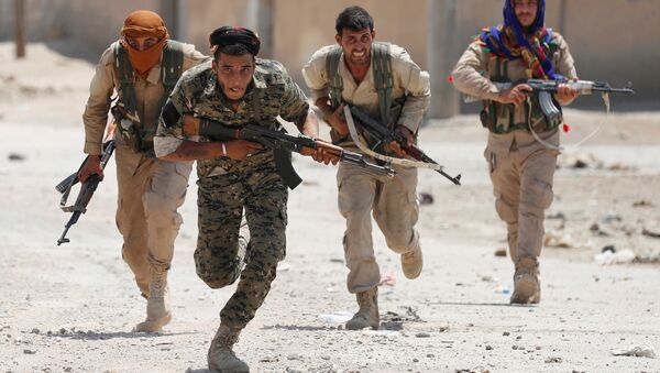 Combatientes de las Unidades kurdas de Protección Popular (YPG) - Sputnik Mundo
