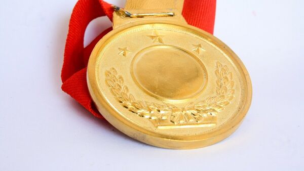 Una medalla de oro, imagen referencial - Sputnik Mundo