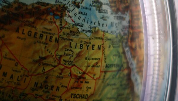 Un mapa de Libia en un globo (imagen referencial) - Sputnik Mundo