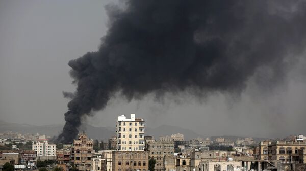 Smoke rises after Saudi-led airstrikes hit a food factory in Sanaa, Yemen. (File)   - Sputnik Mundo