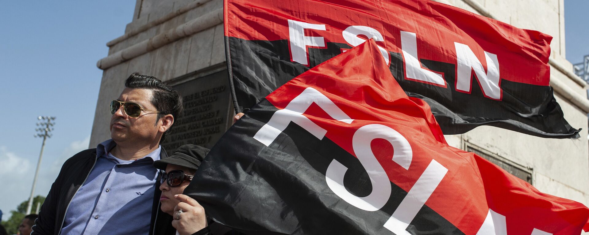 Sandinista porta las banderas del FSLN en el 39 Aniversario de la Revolución nicaraguense - Sputnik Mundo, 1920, 14.07.2022