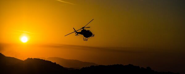 Un helicóptero (imagen referencial) Un helicóptero (imagen referencial) - Sputnik Mundo
