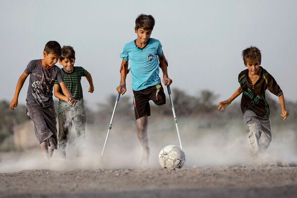 El niño de la foto ganadora del concurso Andréi Stenin asiste a un partido de fútbol en Moscú El niño de la foto ganadora del concurso Andréi Stenin asiste a un partido de fútbol en Moscú - Sputnik Mundo