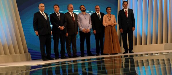 Candidatos durante el debate electoral en Brasil Candidatos durante el debate electoral en Brasil - Sputnik Mundo