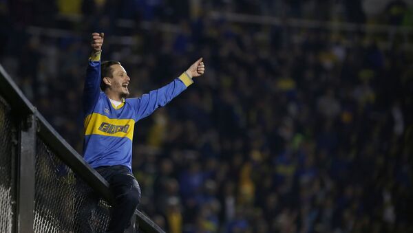 Un hincha de Boca Juniors - Sputnik Mundo