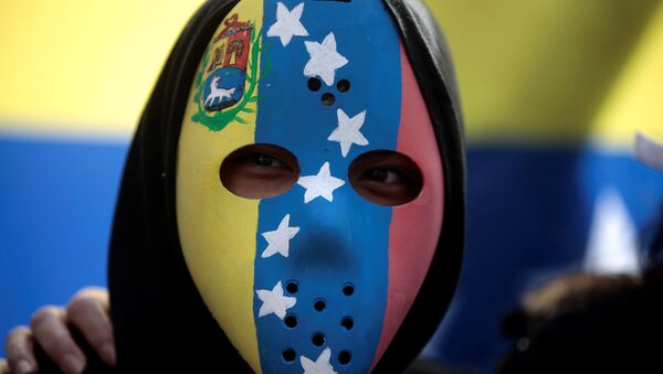 Una máscara con la bandera de Venezuela - Sputnik Mundo