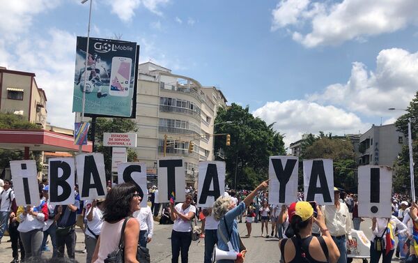 Participantes de la marcha opositora en Caracas - Sputnik Mundo