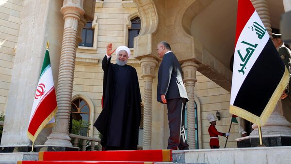 El presidente de Irán, Hasán Rohaní, con su homólogo iraquí, Barham Saleh - Sputnik Mundo