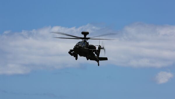 Un AH-64E Apache - Sputnik Mundo